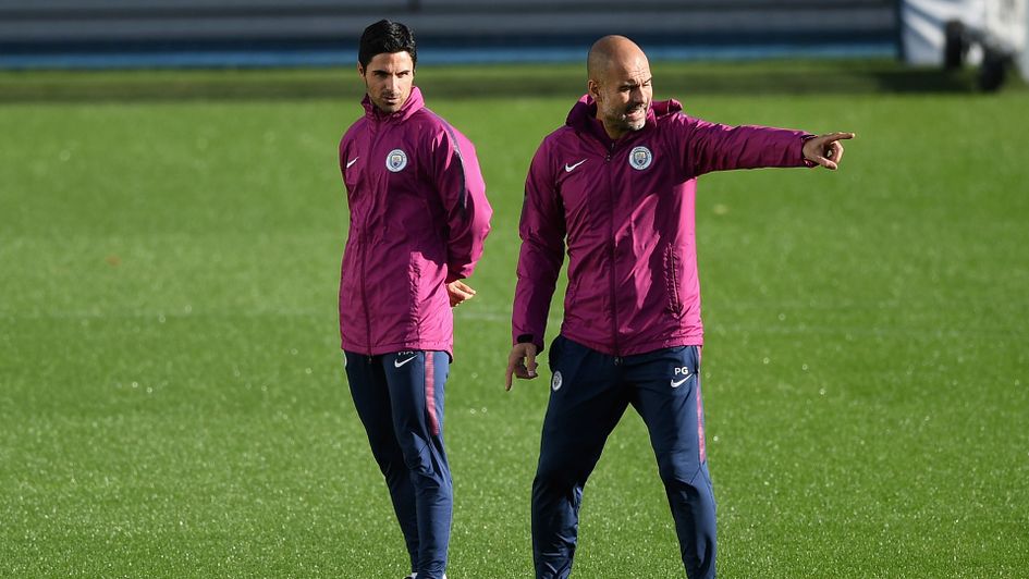 Manchester City boss Pep Guardiola (right) with assistant Mikel Arteta