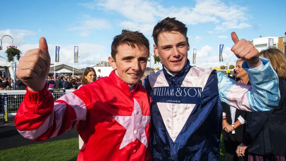 Jockeys Chris Hayes (left) and Cameron Noble celebrate after finishing in a dead heat