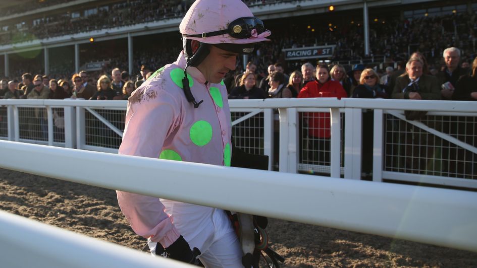 Ruby Walsh walks back after his fall on Annie Power