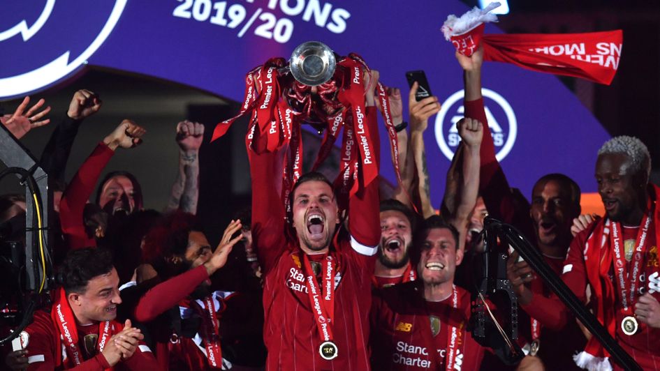 Liverpool captain Jordan Henderson lifts the Premier League trophy