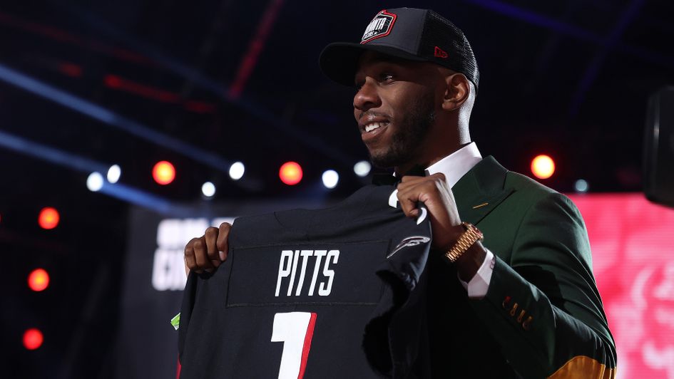 Kyle Pitts poses onstage after being selected fourth overall by the Atlanta Falcons