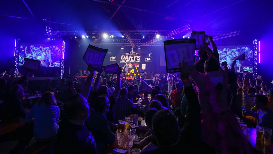 Fans watching the darts