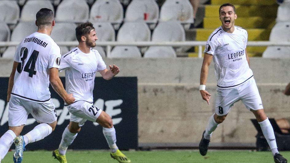 Danel Sinani (right) celebrates a goal in the Europa League