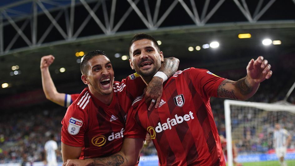 Anthony Knockaert (left) and Aleksandar Mitrovic celebrate a Fulham goal at Huddersfield