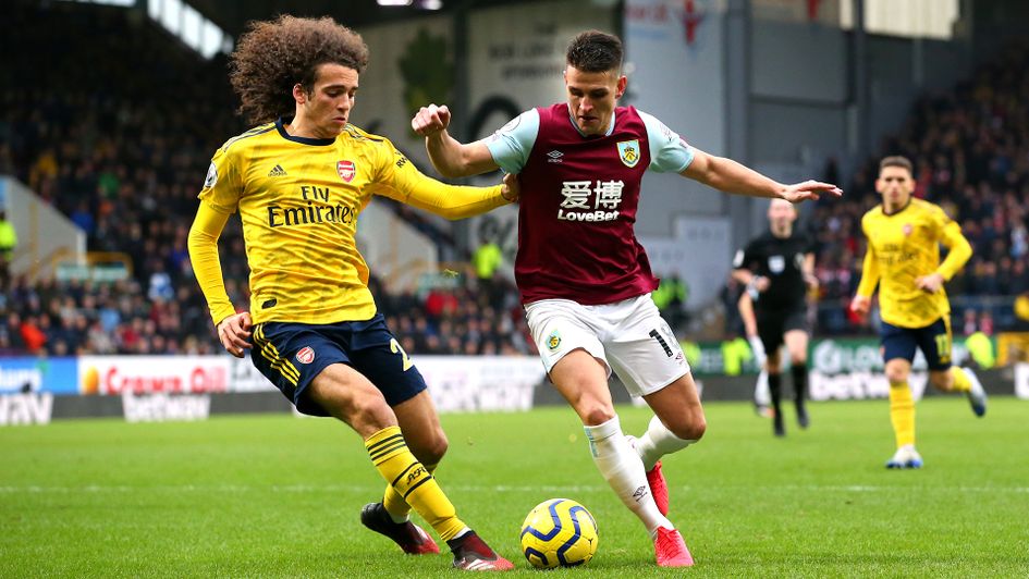 Matteo Guendouzi and Ashley Westwood battle for the ball