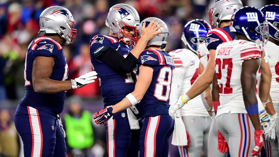 Tom Brady (centre) leads New England Patriots celebrations against New York Giants