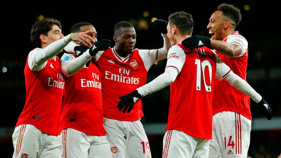Arsenal celebrate Mesut Ozil's goal in the 4-0 victory over Newcastle