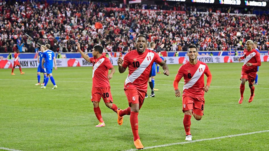 Jefferson Farfan celebrates with his Peru team-mates after scoring v Iceland