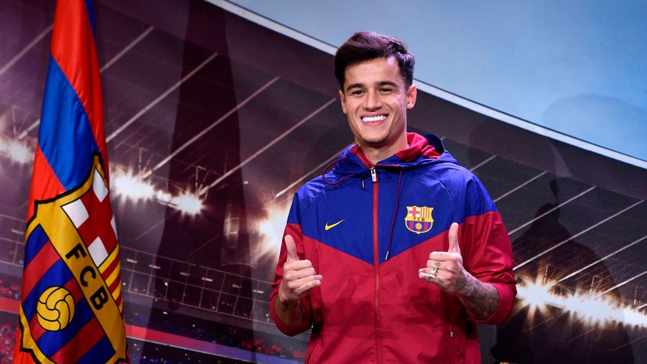 Philippe Coutinho smiles for the cameras