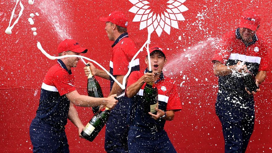 Team USA team celebrate winning the Ryder Cup trophy