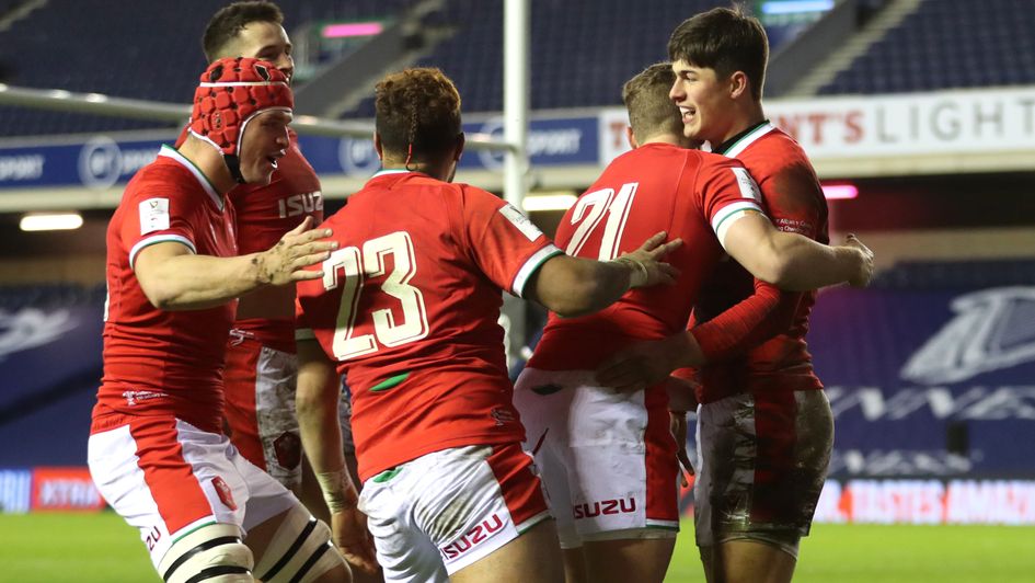 Wales' Louis Rees-Zammit celebrates after scoring the winning try