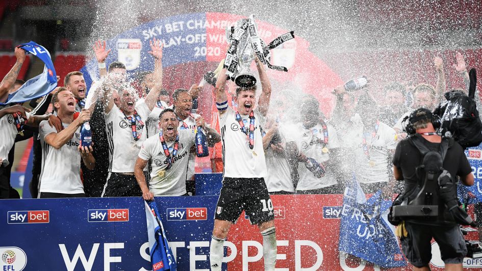 Tom Cairney: Fulham captain lifts the Sky Bet Championship play-off final trophy at Wembley