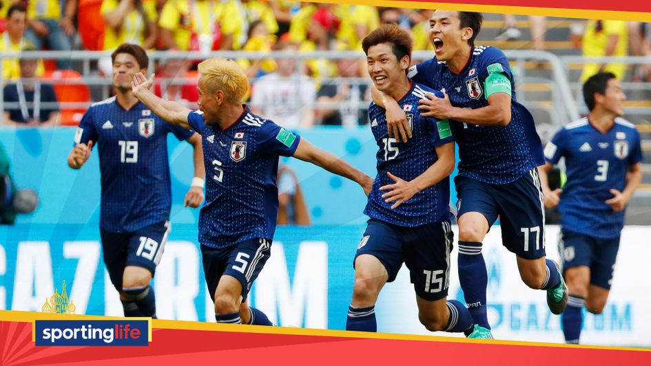Yuya Osako (second, right) celebrates Japan's World Cup goal with his team-mates